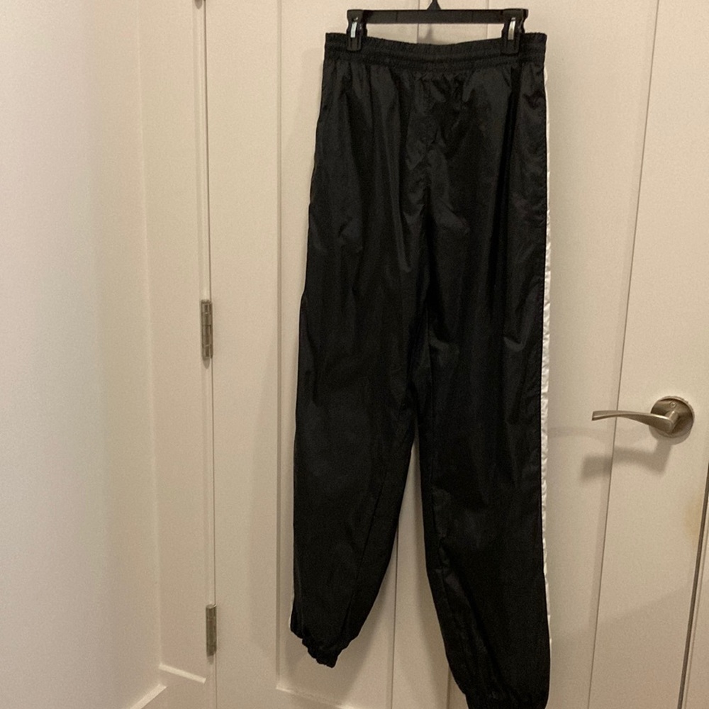 Mens water resistant athletic pants. FILA.